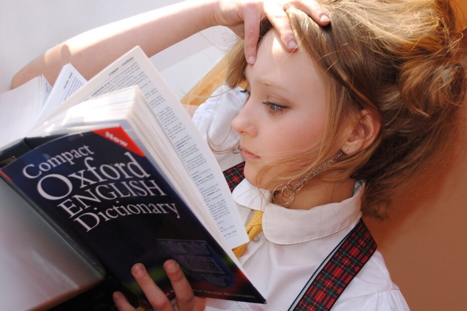 A girl reads the Oxford English Dictionary