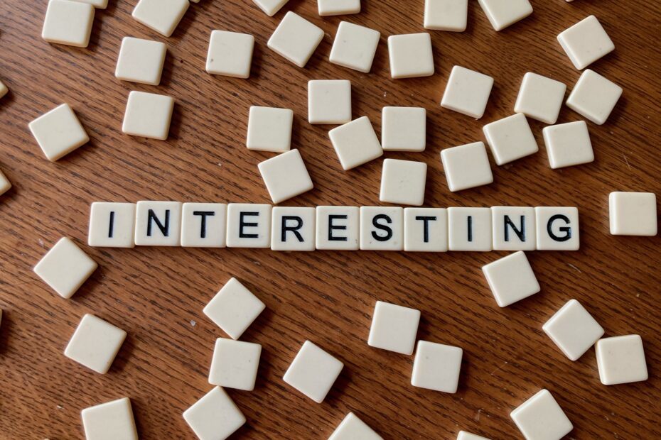 Bananagrams letters spell out the word "interesting"