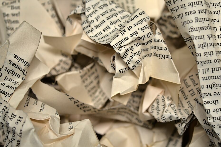 crumpled pages covered in text